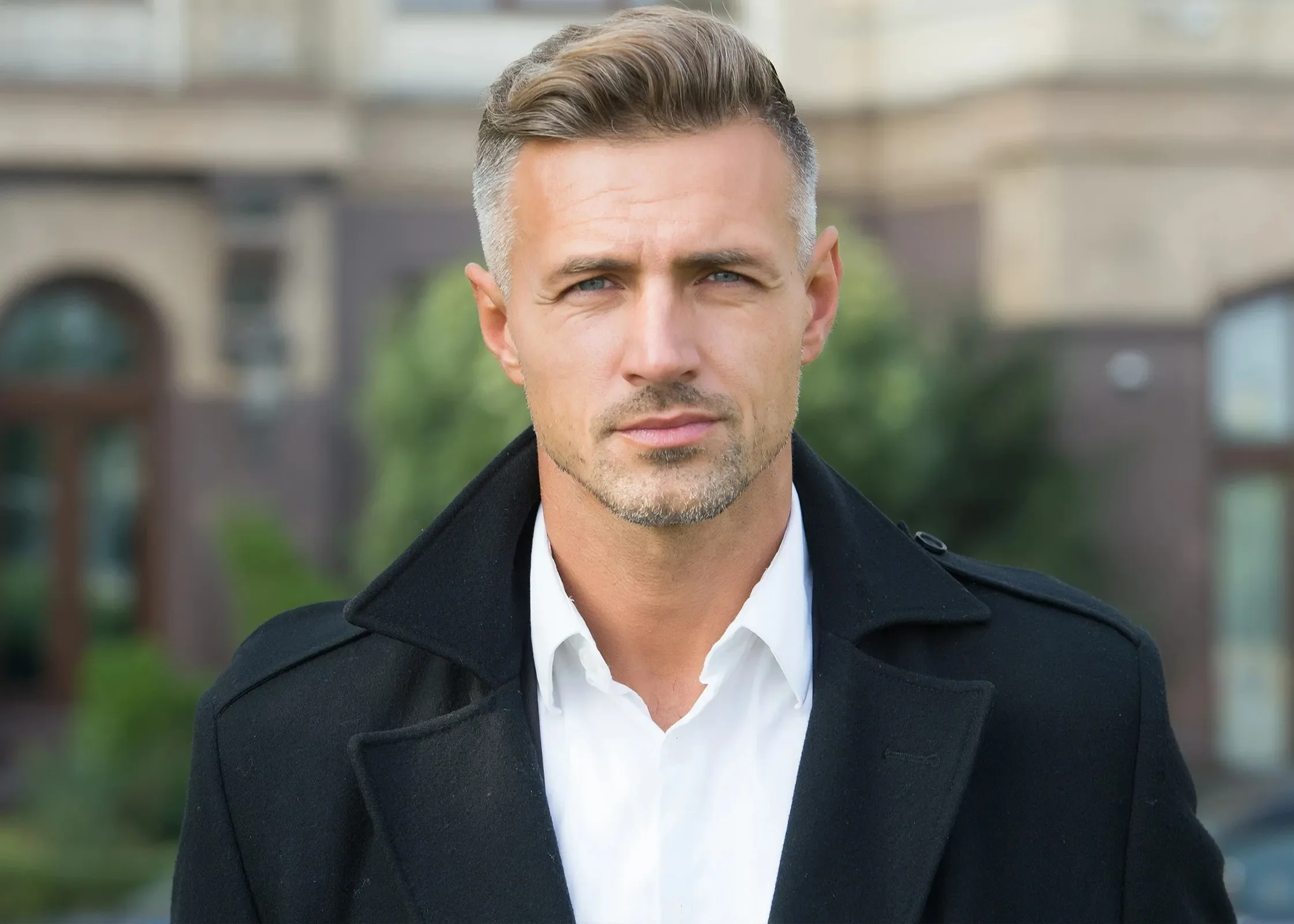 Portrait of a man with short styled hair.