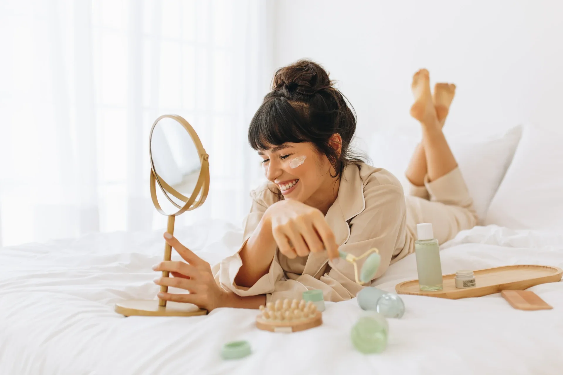 Woman reaching for a drink beside her bed.