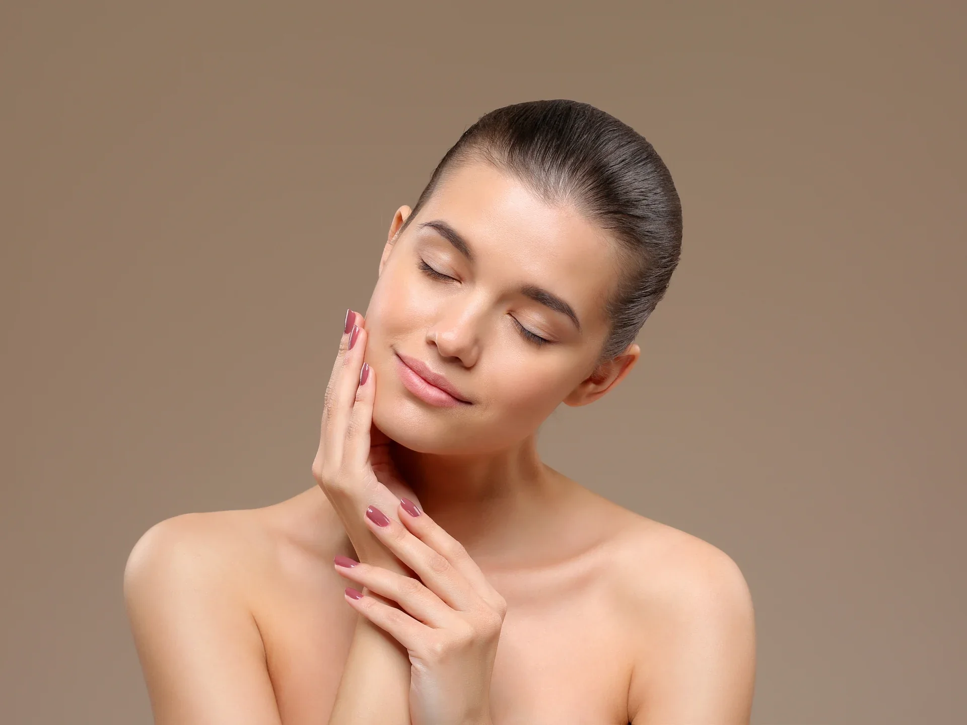 Woman touching her cheek and neck.
